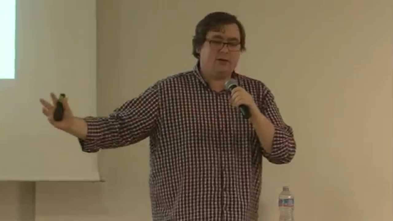 Photo of me presenting at a conference