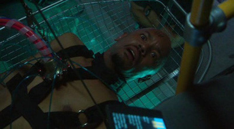 A character we know about to be lowered into a sensory deprivation prison tank