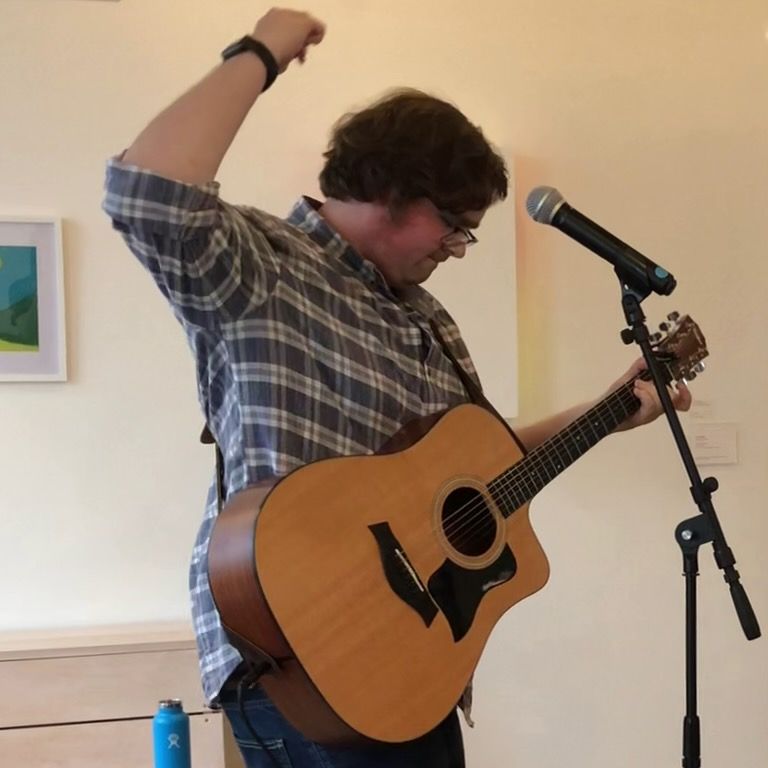 Photo of me playing guitar.