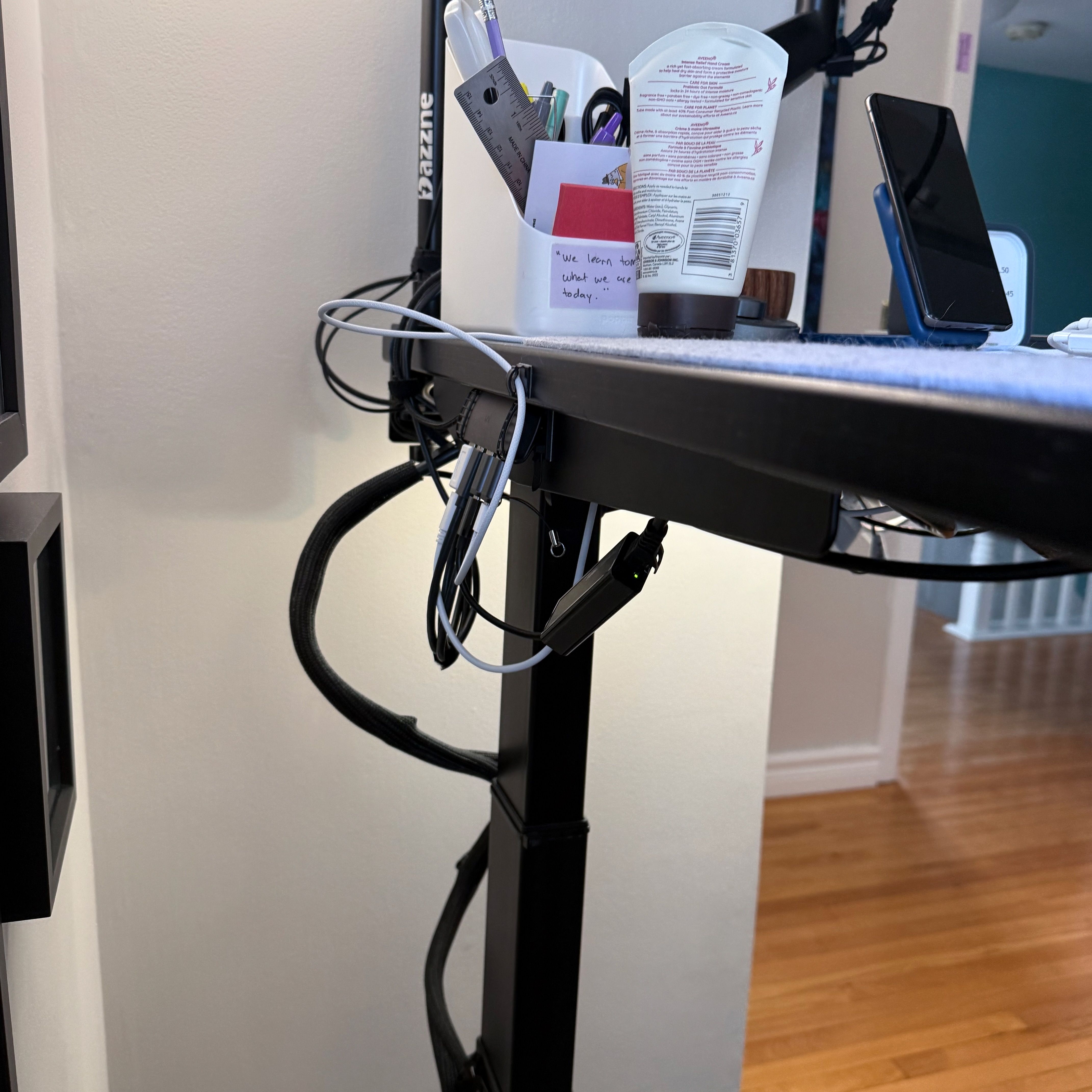 USB hub taped to a desk without available ports.