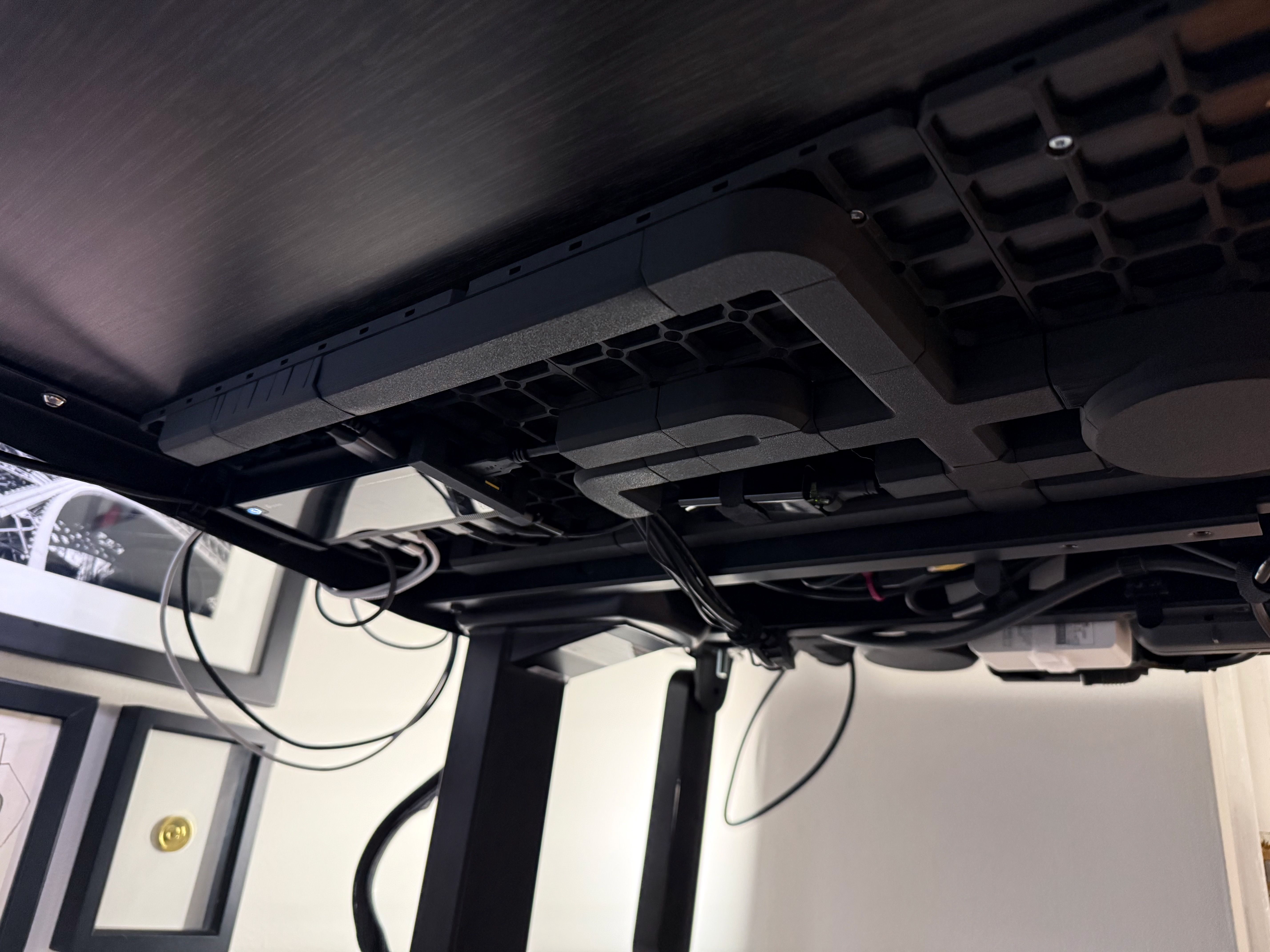 Photo of under my desk, with the cables all in channels.