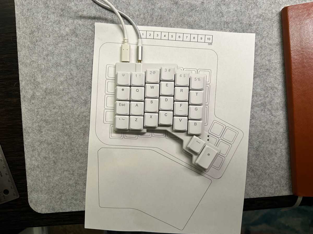 Voyager keyboard sitting on top of to-scale ErgoDox EZ